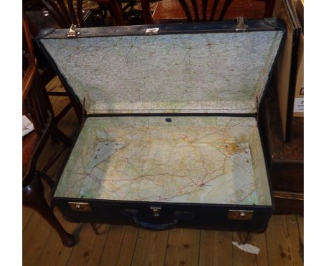 A 30" vintage trunk as a coffee table, set on chrome plated legs