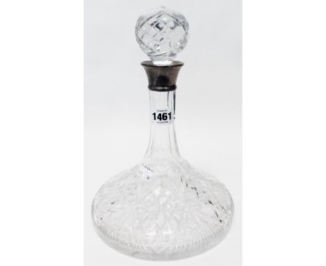 A cut glass ship's decanter with star cut base and silver collar - Sheffield 1979