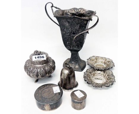 An Anglo Indian white metal pumpkin pattern caddy with push-fit lid and allover embossed decoration - sold with two circular 