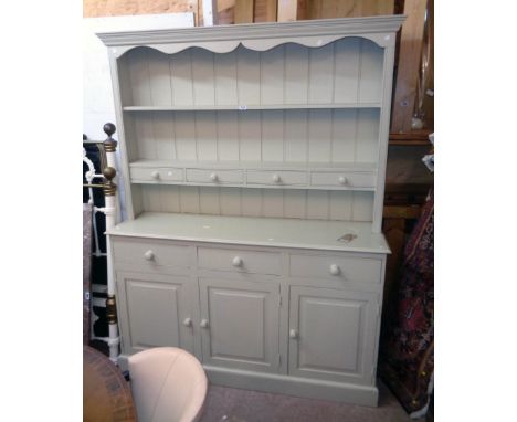 A 5' modern painted pine two part dresser, the two shelf open plate rack with four short drawers over a base with three drawe