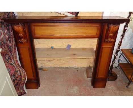 A 4' 6" 20th Century stained mixed wood fire surround with flanking acanthus scroll capitals