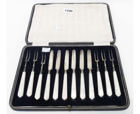A cased set of six each silver fruit knives and forks with mother-of-pearl handles - by George Hape, Sheffield 1932