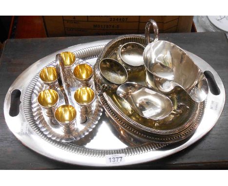 A silver plated tray, egg cruet, two gravy boats, etc.