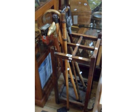 Various walking sticks and a Resto shooting stick - sold with a 20th Century stained oak stick stand, drip tray missing