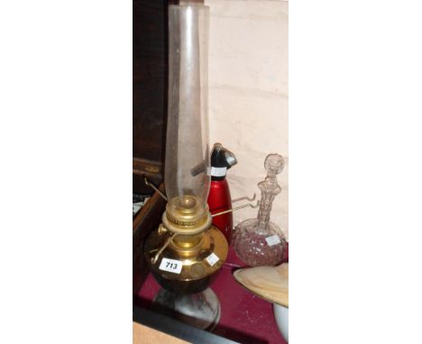 An Aladdin oil lamp, vintage soda syphon and a decanter