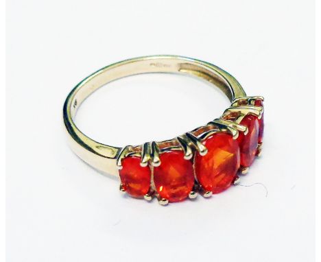 An import marked 375 gold ring, set with five orange coloured stones