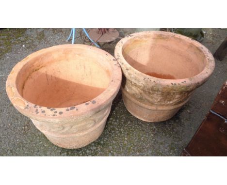 A pair of large terracotta garden pots