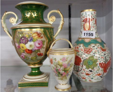 A Coalport two-handled urn with floral panel on green ground (a/f), a Royal Worcester porcelain footed basket vase with lion 