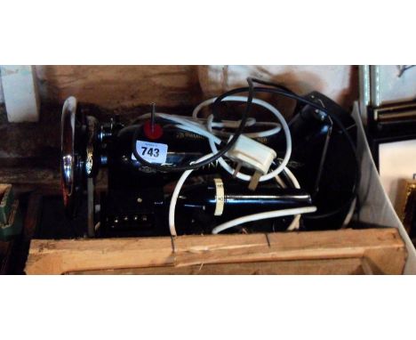 A Singer sewing machine with light