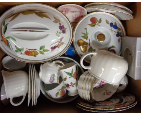 A box containing a quantity of Royal Worcester Evesham ware including tureens, ramekins, cups and saucers, etc.
