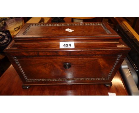 A 13" 19th Century rosewood sarcophagus twin compartment tea caddy with beaded boarders, two internal lit-top compartments an