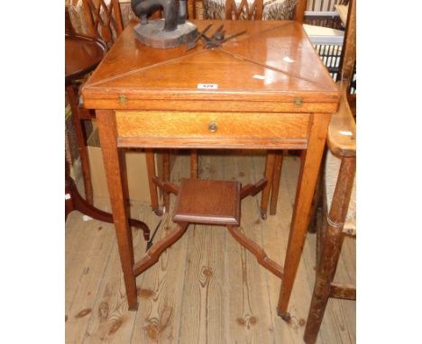 A 20" Edwardian stained oak envelope card table with moulded undertier and square supports - a/f