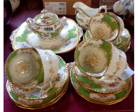 A Coalport Panel Apple Green pattern six place tea set, comprising six trios, bread plate, milk jug and lidded sucrier