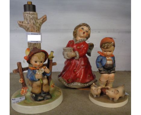 A Hummel lamp base, one musical figure and two others