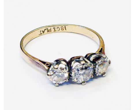 A marked 18ct./PLAT three stone diamond ring