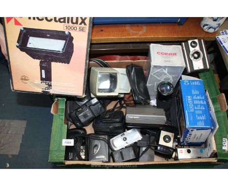 A box of cameras including a boxed Flectalux 10000 SE halogen lamp, boxed Polaroid instant camera, Coronet Twelve 20 camera, 