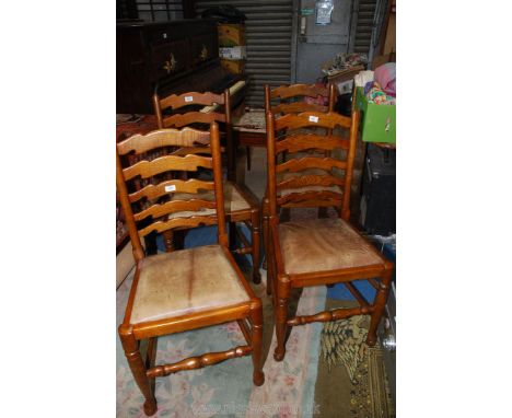 A set of four Oak framed ladder back Dining Chair having turned front legs terminating in pad feet and united by turned stret