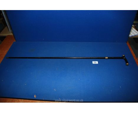 An ebonised walking stick with 15ct gold plated collar and tips, initials on collar 'G.C.H.'.