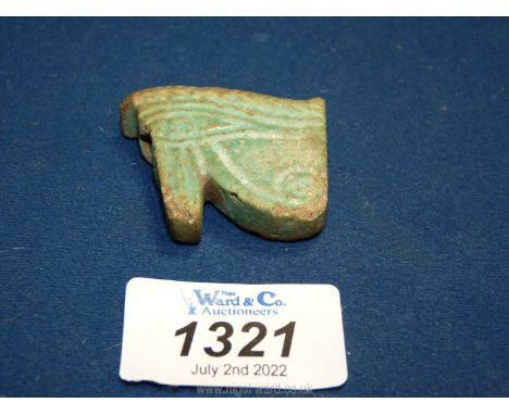 A large ancient Egyptian blue faience wajdet eye amulet, probably New Kingdom (chipped).