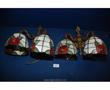 A pair of twin wall light fittings and four Tiffany style shades in cream with red flowers and green leaves detail.