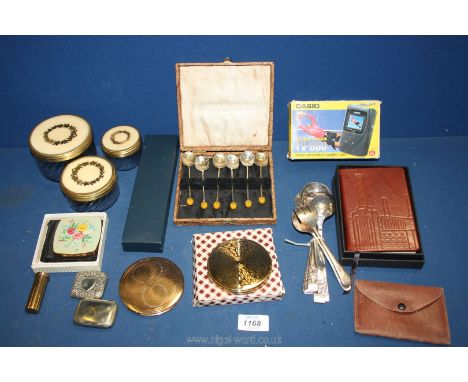 A quantity of miscellanea including Harrods boxed Notebook, Casio Mini TV, compacts, glass dressing table pots with cream and