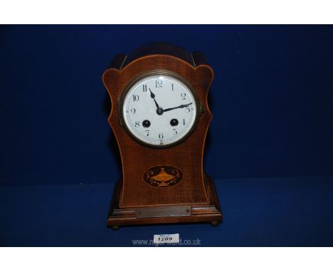 A wooden cased Mantle clock with Arabic numerals and presentation plaque for the marriage of Mr Herbert Ravalde, 17th August,