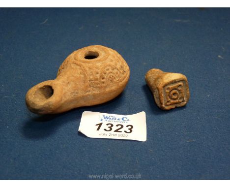 A fine Hellenistic terracotta oil lamp with well defined moulded decoration (2nd-1st c. BC) and an ancient terracotta stamp o