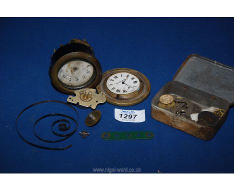 A box of vintage clock components.
