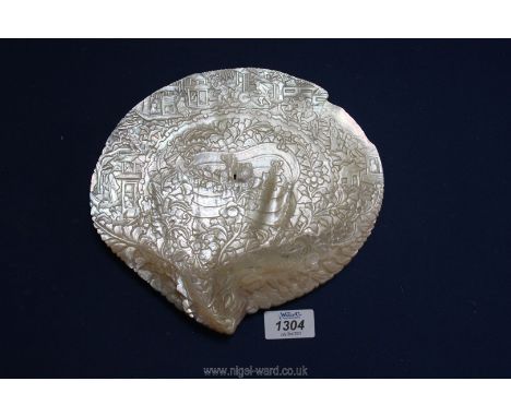 A carved Chinese Mother of pearl plaque, 22 cm diameter.