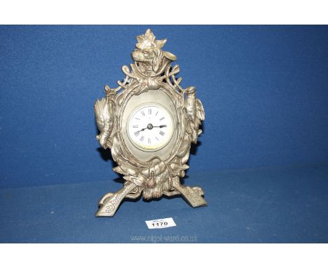 An art Nouveau white metal mantle Clock in hunting pattern with spaniels and pheasants.