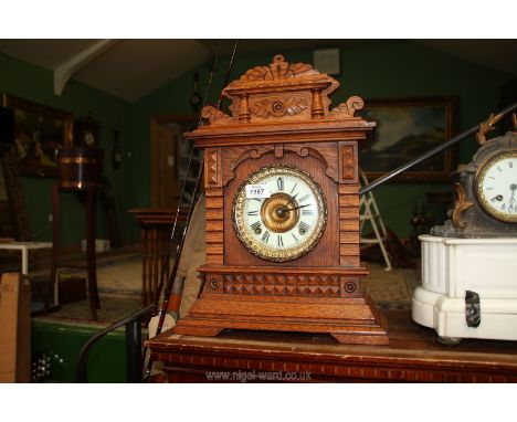 A wooden eight day mantle clock Syria made in Arizona by New York clock company, 18" tall.