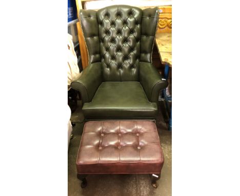 BOTTLE GREEN BUTTON BACKED FAUX LEATHER WING ARMCHAIR ON CABRIOLE LEGS AND BROWN LEATHERETTE FOOT STOOL