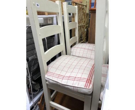SET OF FOUR CREAM PAINTED LADDER BACK CHAIRS WITH TIE-ON CHEQUERED CUSHIONS 