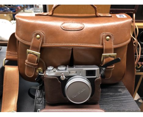 FUJI X100 CAMERA WITH TRAVEL BAG INC. BATTERY PACK AND MASTERING THE FUJI BOOKLET