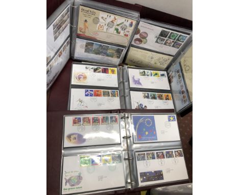 FIVE ROYAL MAIL FIRST DAY COVER ALBUMS AND POSTAGE COVERS, SOME WITH COIN COVERS