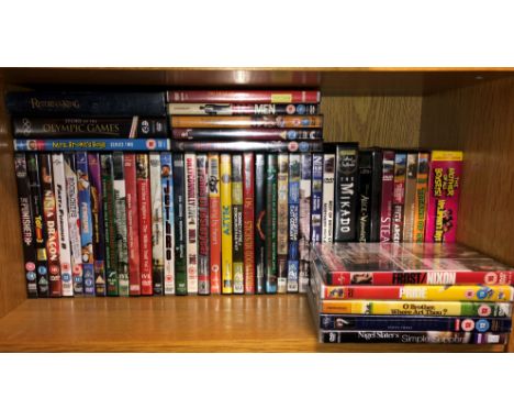 SHELF OF ASSORTED DVDS 