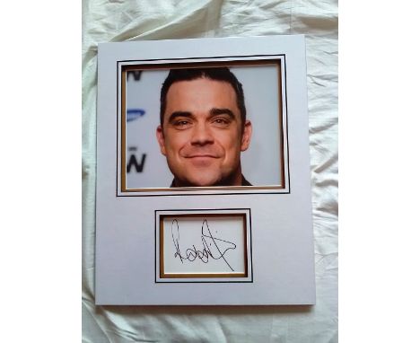 Robbie Williams signed autograph presentation. High quality professionally mounted 16 x 13 inch overall sized display. 3D dou
