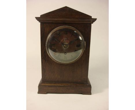 A WWII RAF ward room mantel clock: the single fusee movement with Arabic numeral dial marked with RAF cipher, in an oak archi