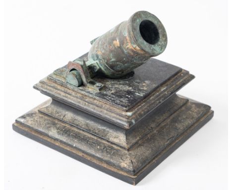 A 19th century cast bronze desk mortar on an ebony plinth, 12cm high.
