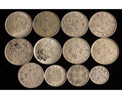 Twelve silver Chinese coins.: