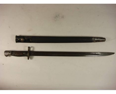 A 1907 pattern bayonet for a Lanchester sub machine gun: the blade stamped 'WSC 294 9-43' over a two piece wooden grip in a b