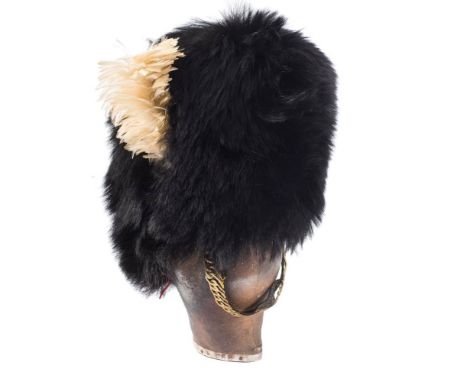 A late 19th/early 20th century Royal Welsh Fusilier Officer's bearskin by Cater &amp; Co, London:, black fur with cap badge a