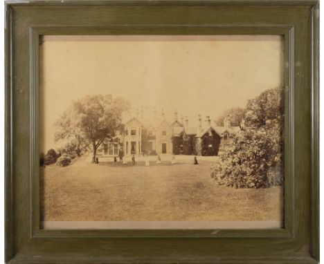 An early 20th century photograph of a croquet game at a country house,: together with a photograph of two young pugilists and