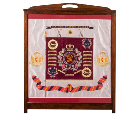 A late 19th/early 20th century regimental silk for the 1st (Kings) Dragoon Guards:, the central regimental flag with battle h