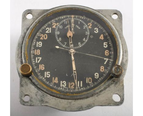 A WWII Spitfire cockpit clock Mk IIIB, by Smith & Son, London: black dial with 24 hour luminous Arabic numerals, time trip di