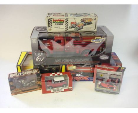 A group of various scale model vehicles: including a 1/16th  Highway 61 Chevrolet 1941 Pumper Firetruck, a 1/18th  1954 Plymo