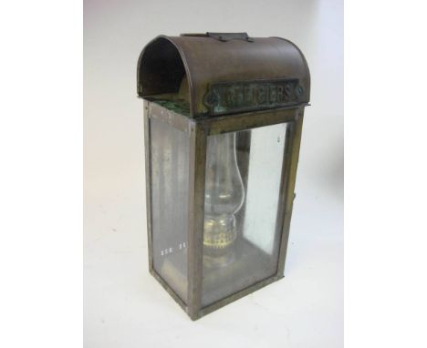 A  French brass rectangular 'Officers' ship's lamp: with handle over arched top and glazed body enclosing oil burner, 44cm hi