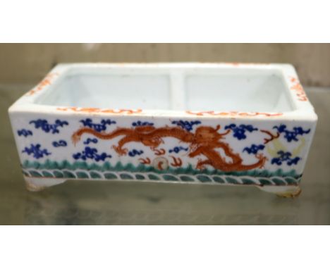A CHINESE PORCELAIN RECTANGULAR NARCISSI POT PAINTED WITH FOUR STRIDING IRON RED DRAGONS PURSUING THE PEARL OF WISDOM, AMONGS