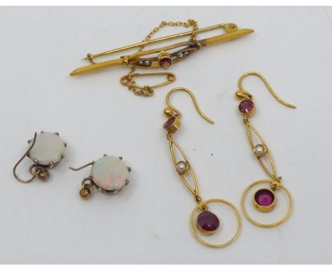 A selecton of gold jewellery to include a pair of round opal earrings in yellow metal, tests as 9ct; a pair of Edwardian garn