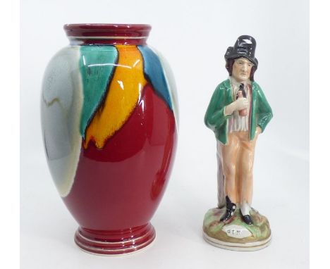 A Staffordshire Temperance figure "Gin" and "Water" and a Poole pottery baluster vase, partly flambe glaze, printed mark, 24c